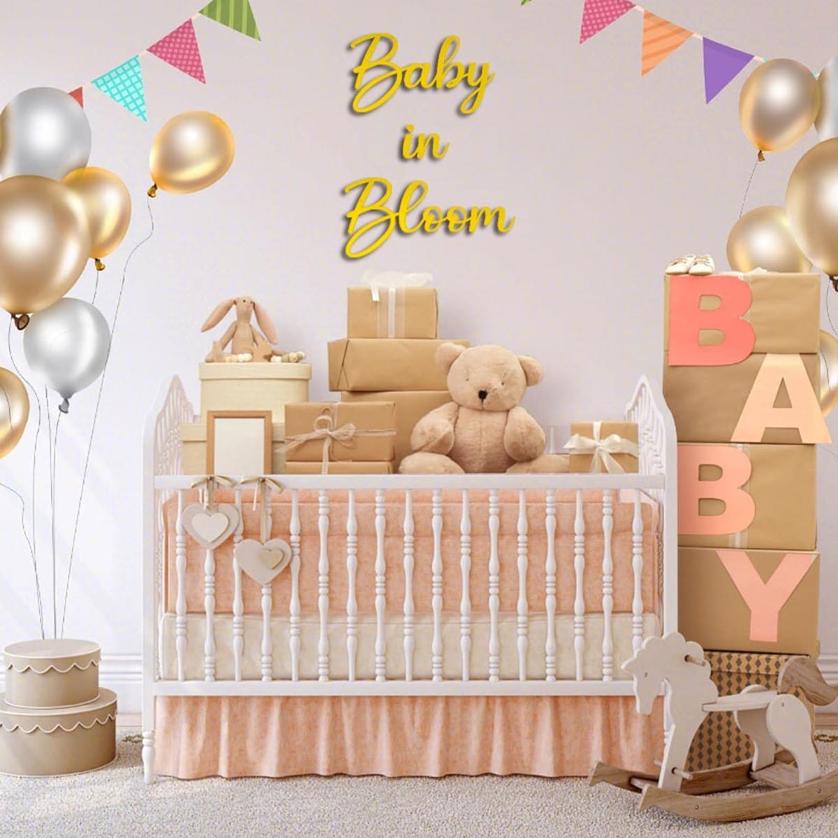 Accessoires pour la fête : chambre de bébé décorée avec berceau, cadeaux, ballons et panneau « Bébé en fleurs ».